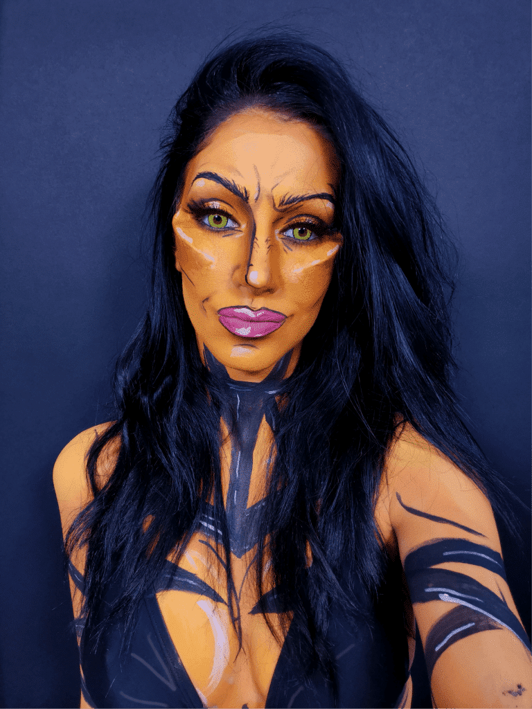 A woman with a cat face makeup.