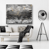 A black and white living room with an abstract painting inspired by the product name "As Above So Below".