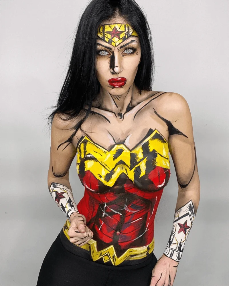 A woman in a wonder woman costume posing for a photo.